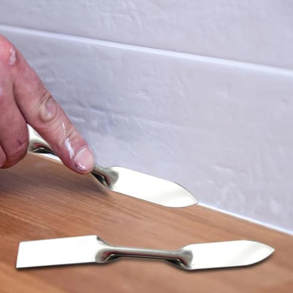Double headed plastering trowel, stainless steel caulking and seam repair tool